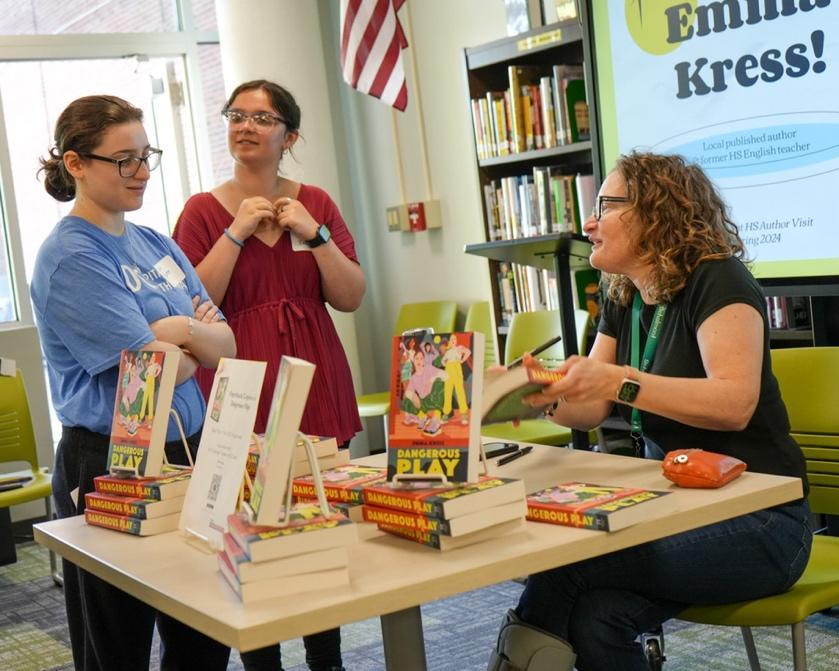 Emma Kress signing copies of Dangerous Play during an author visit